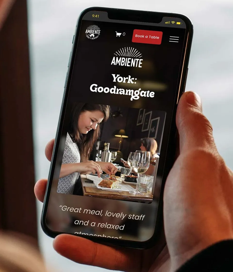 Ambiente Tapas website on a phone, showing their Goodramgate restaurant in York
